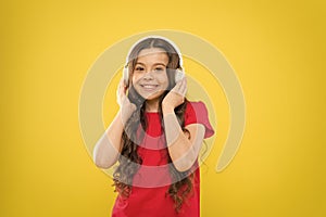 Top songs. Child teen enjoy music playing in earphones. Little girl enjoying favorite music. Catch the rhythm. Kid