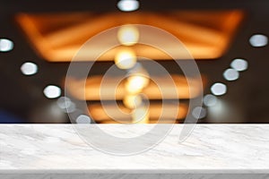 Top table with bokeh light blur restaurant. Marble empty table in front of blurred background. White marble granite over blur in