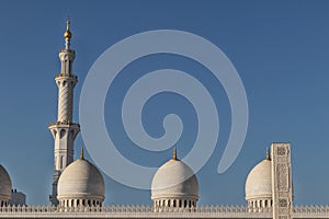 Top of tower and dome of arab mosque in Abu Dhabi. UAE