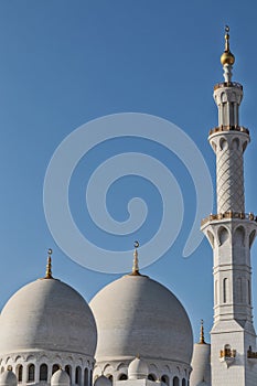 Top of tower and dome of arab mosque in Abu Dhabi. UAE