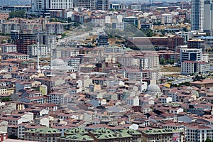 Top urban view of lots houses in Istanbul city, Turkey. Crowded red roofs and mosque.