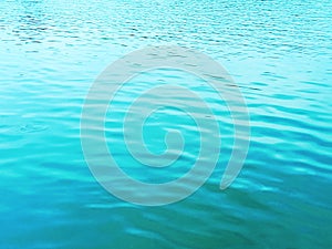 Top veiw, Abstract blurred blue water wave texture background for design or stock photo, illustration, rippled water