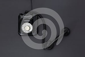 Top view of 1960` s retro telephone isolated on a black background. Space for text