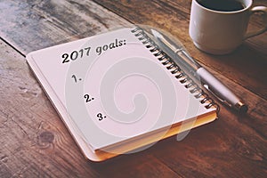 Top view 2017 goals list with notebook