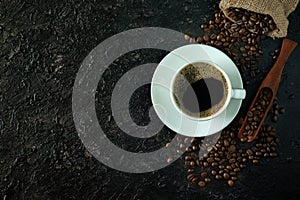 Top view above of Black hot coffee with milk foam for morning beverage menu in white ceramic cup