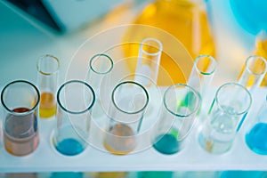 Top view above of science laboratory test tubes. Liquid many colors in equipment glassware for chemistry biology samples.