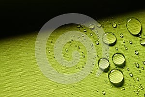 Green textile with water drops photo