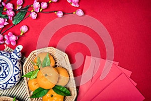 Top view accessories Chinese new year festival,leaf,wood basket,red packet,plum blossom