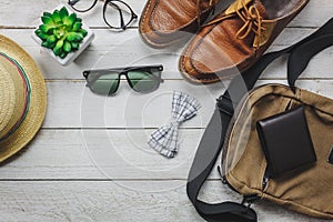 Top view accessories to travel with man clothing concept.