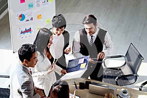 Top view of achievement successful businesspeople shares idea, presentation at conference meeting desk, business team have