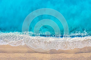 Top view aerial drone photo of Myrtos beach with beautiful turquoise water and sea waves. Vacation travel background. Ionian sea,