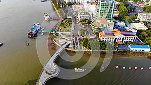 Top view aerial view love bridge or Ninh Kieu quay of downtown in Can Tho City, Vietnam with development buildings, transportation