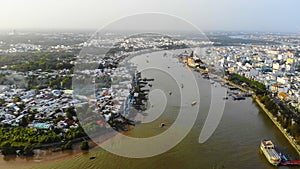 Top view aerial view love bridge or Ninh Kieu quay of downtown in Can Tho City, Vietnam with development buildings, transportation