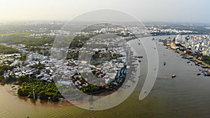 Top view aerial view love bridge or Ninh Kieu quay of downtown in Can Tho City, Vietnam with development buildings, transportation