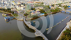 Top view aerial view love bridge or Ninh Kieu quay of downtown in Can Tho City, Vietnam with development buildings, transportation