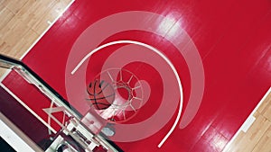 Top view of an african ethnicity basketball player throwing a ball into the basket
