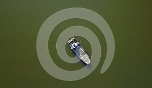 Top view on angling fisherman in boat