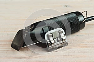 Top view of animal grooming, electric sheering tool with extra blaid photo