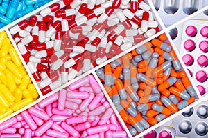 Top view of antibiotic capsules and tablet pills. Antibiotic drug resistance. Superbug. Full frame of multi-colored pills.
