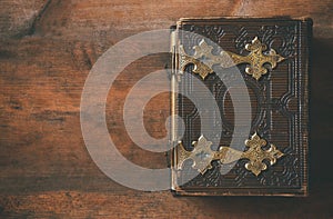 Top view of antique book cover, with brass clasps