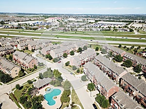 Top view apartment building with pool near interstate 635 highway clear blue sky