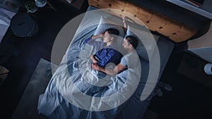 Top View Apartment: Happy Young Couple Side Cuddling Together in the Bed Sleeping at Night