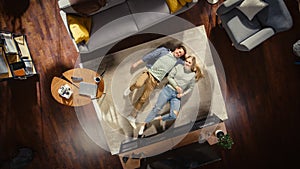 Top View Apartment: Young Couple in Love Lying on the Floor and Talking, Sharing Dreams, Aspirations