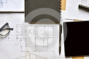 a top view of architect working desk with equipments for drawings pens sketched idea on wood table