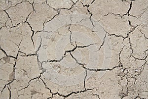 Top view of arid land with dry cracked ground
