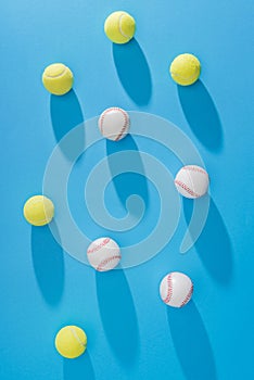 top view of arranged tennis and baseball balls