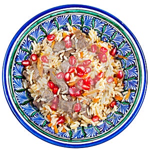 Top view on asian pilaf with pomegranate