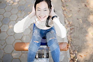 Top view,asian schoolgirl practicing fitness,doing sit up exercise for health and strength in outdoor at school, happy smiling