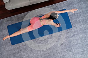 Top view asian woman in sportswear doing yoga exercise. Vigorous