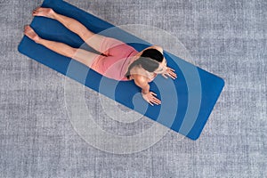 Top view asian woman in sportswear doing yoga exercise. Vigorous