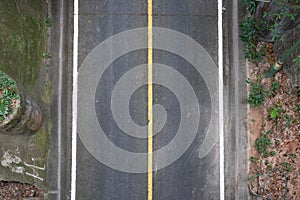 Top view of asphalt concrete road with highway line marks in mountain