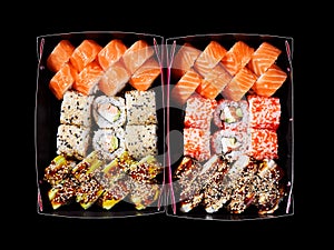 Top view of assorted sushi in cardboard boxes ready for delivery.