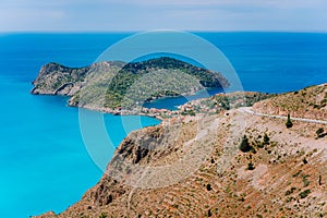 Top view of Assos village located in cute bay on beautiful blue sea coastline, Kefalonia island, Greece