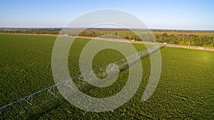 Top view of an automatic irrigation system in a green field