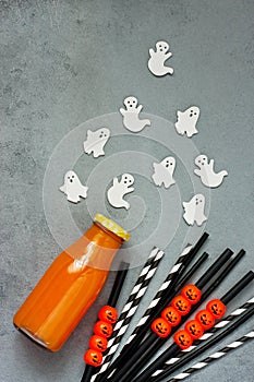 Top view at  autumn drink  for Halloween  and colorful decorations on   gray  background