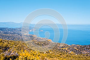 Top view from the autumn mountains to the village of Malia, roads and the nearby villages of the field and the Aegean Sea. Crete