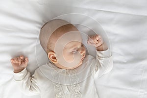 Top view of baby infant sleeping in bedroom