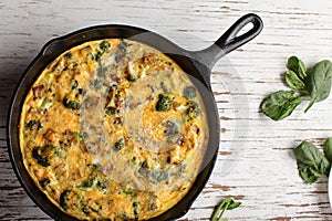Top view of baked egg frittata with spinach