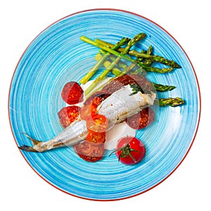 Top view of baked whiting with vegetables