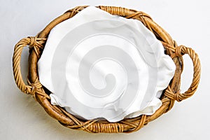 Top view on bakery basket with napkin