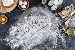 Top view of bakery lettering made of flour and various ingredients for baking