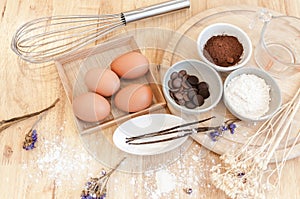 Top View Baking Preparation on wooden Table,Baking ingredients. Bowl, eggs and flour, rolling pin and eggshells on wooden board,