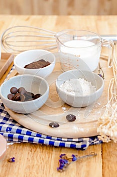 Top View Baking Preparation on wooden Table,Baking ingredients. Bowl, eggs and flour, rolling pin and eggshells on wooden board,