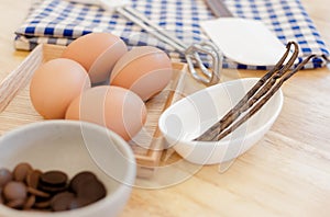 Top View Baking Preparation on wooden Table,Baking ingredients. Bowl, eggs and flour, rolling pin and eggshells on wooden board,