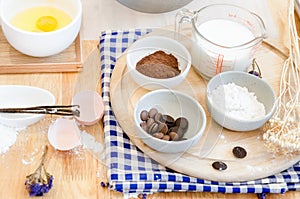 Top View Baking Preparation on wooden Table,Baking ingredients. Bowl, eggs and flour, rolling pin and eggshells on wooden board,