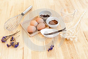 Top View Baking Preparation on wooden Table,Baking ingredients. Bowl, eggs and flour, rolling pin and eggshells on wooden board,